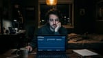 Productive procrastination for solo SaaS founders — developer staring at laptop showing zero users dashboard at night